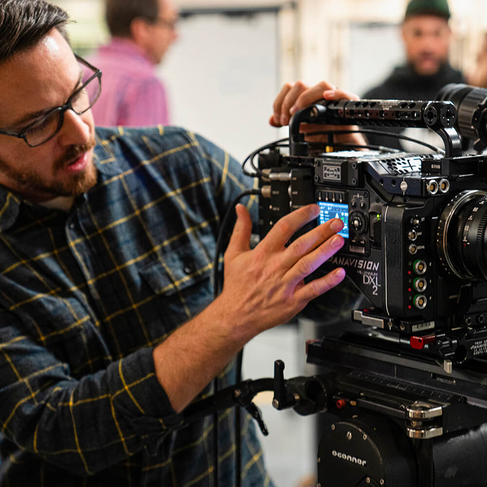 Expert showcases the menu of the DXL2 cinema camera on a prep floor